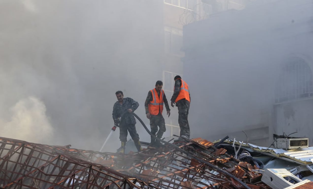 Рятувальники гасять пожежу після удару по посольству Ірану. Фото: REUTERS