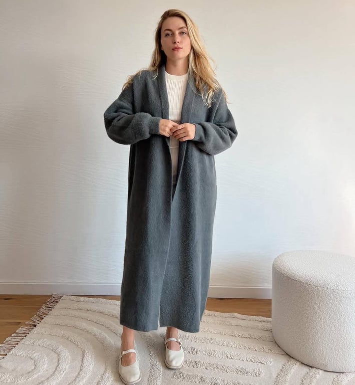 A gray cardigan is a wardrobe staple.