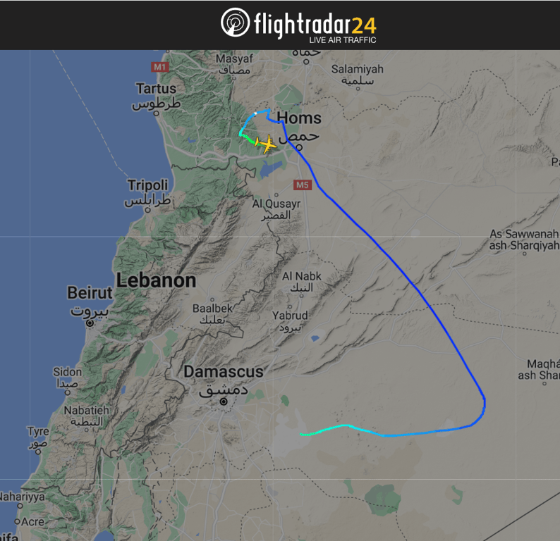 Літак Асада в небі