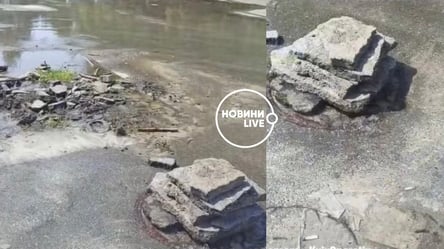 В Киеве посреди дороги забил фонтан: его прикрыли камнями. Видео - 285x160