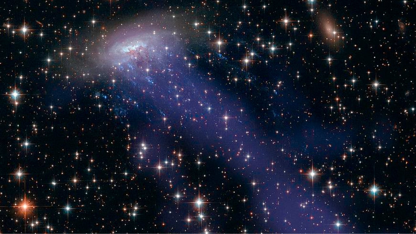Космические щупальца: телескоп Hubble показал, как выглядит медузообразная галактика в созвездии Китая