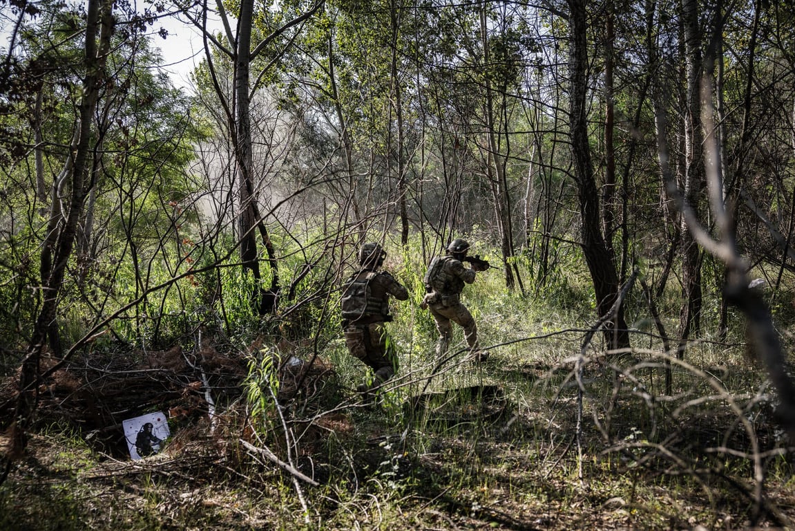 U.S. and other foreign volunteer soldiers in a live-fire exercise in July.
