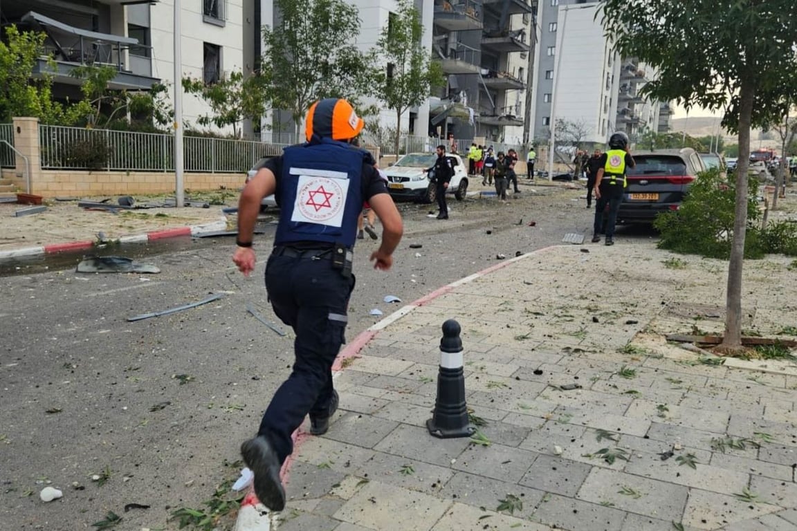 an emergency worker at the site of an Iranian missile strike in Beer Sheva, Israel, on Friday