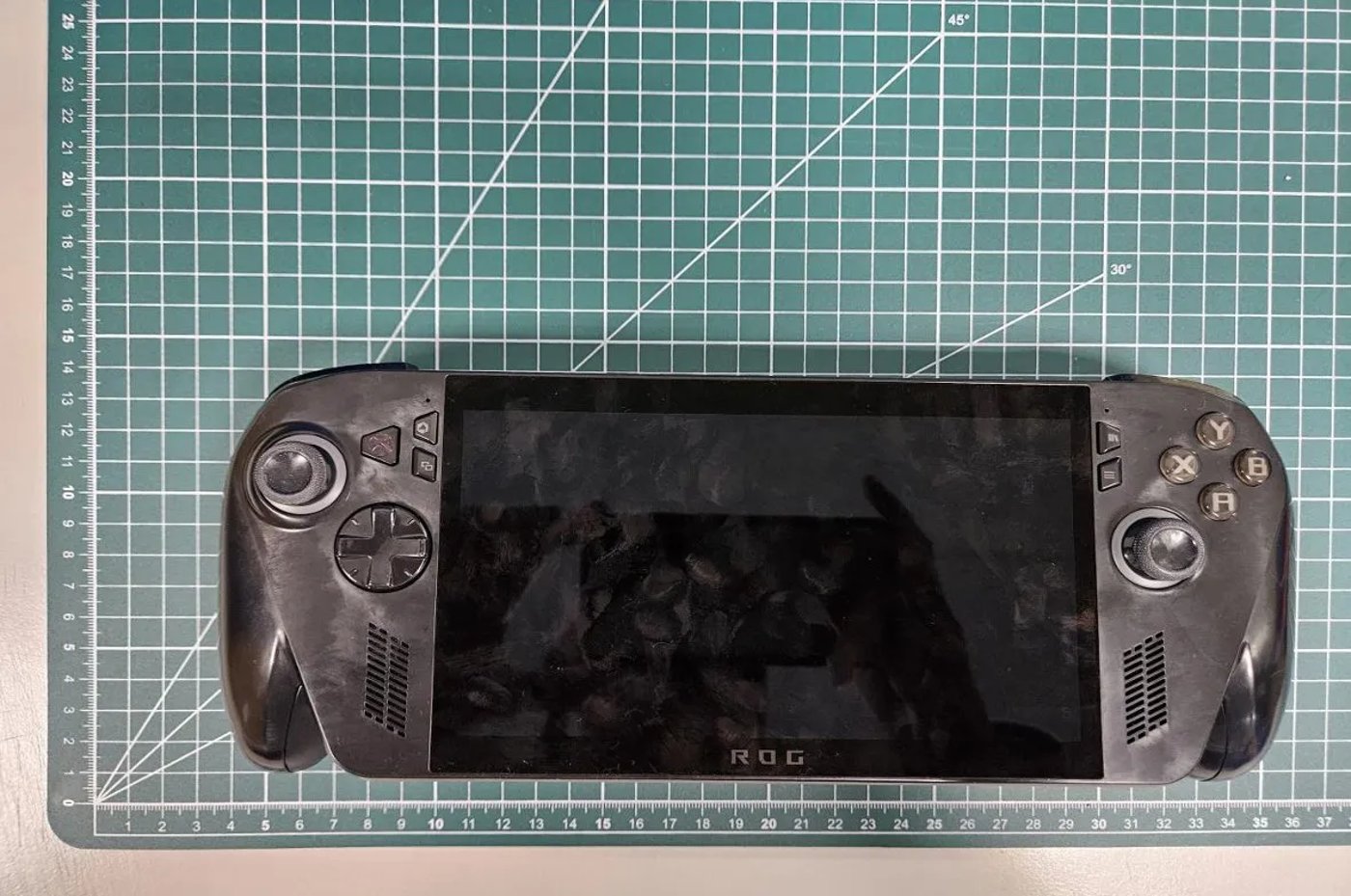 Xbox button on a portable game console