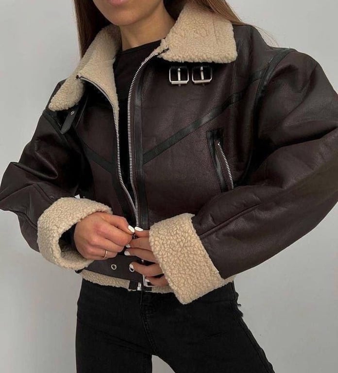 A brown shearling coat has an expensive look