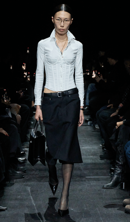 A white shirt paired with a skirt is on trend