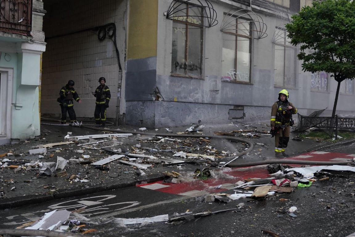 Rescuers at the scene of the shelling